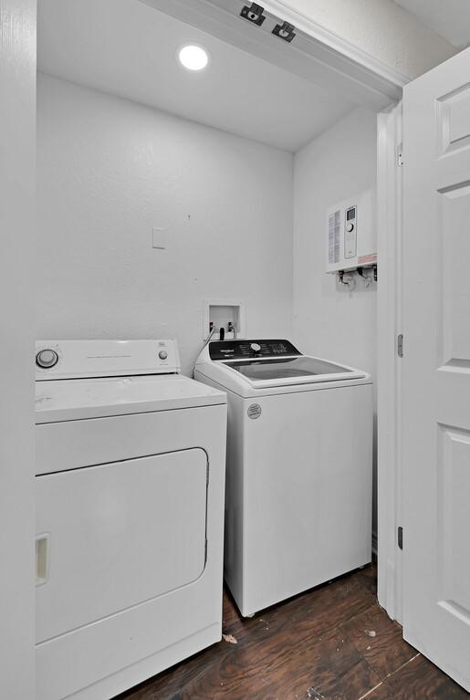 2709 Sarah St, Waco, TX 76706 - laundry area with washing machine and dryer, recessed lighting, and dark wood-type flooring