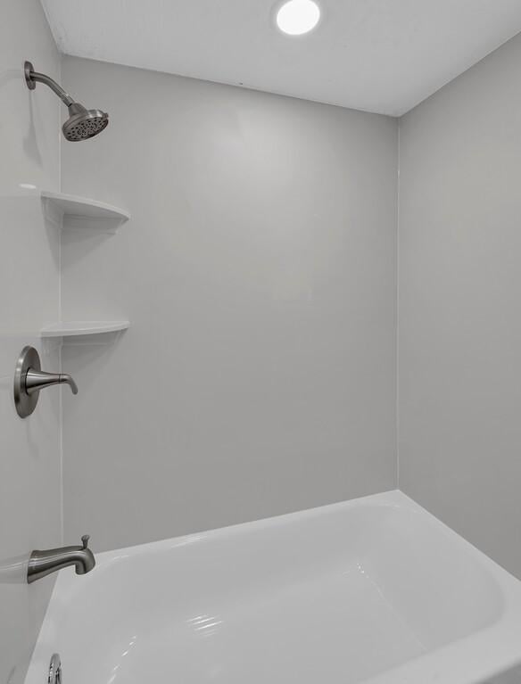 2709 Sarah St, Waco, TX 76706 - bathroom featuring a shower and a tub to relax in