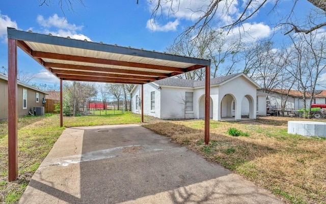 2709 Sarah St, Waco, TX 76706 - view of parking / parking lot with driveway and a detached carport