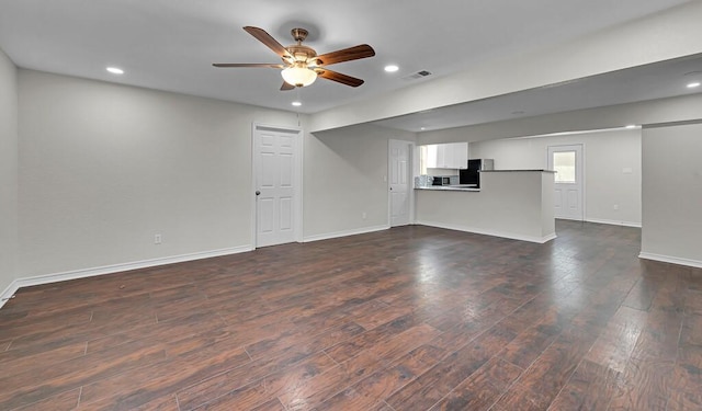 2709 Sarah St, Waco, TX 76706 - unfurnished living room with dark wood-style flooring, a ceiling fan, baseboards, and recessed lighting