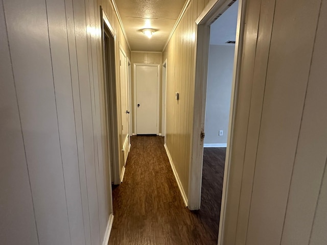 204 Austin Ave, Corsicana, TX 75110 - hall with baseboards, dark wood finished floors, and ornamental molding