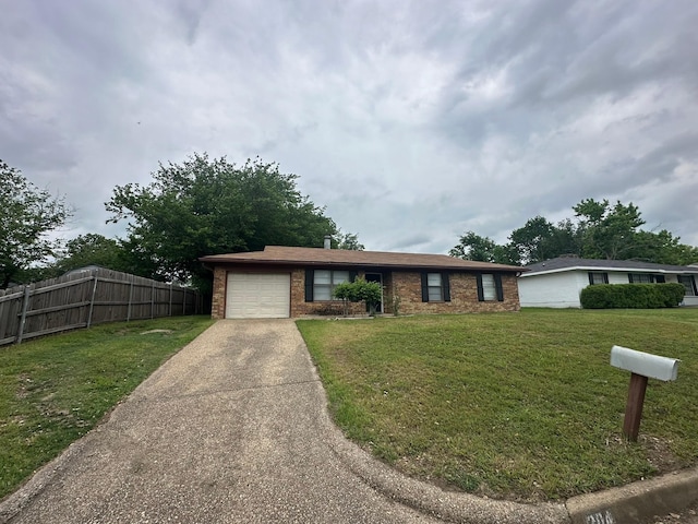 204 Austin Ave, Corsicana, TX 75110 - ranch-style home with a garage, concrete driveway, and brick siding