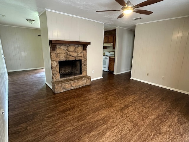 204 Austin Ave, Corsicana, TX 75110 - unfurnished living room with dark wood finished floors, crown molding, a fireplace, ceiling fan, and baseboards