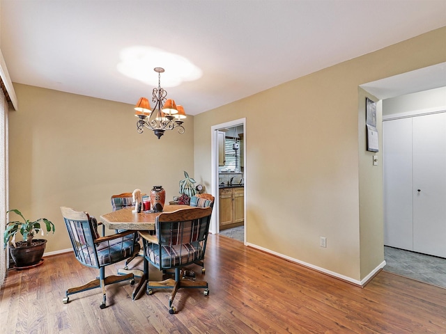 19 Park Ln, Bedford, TX 76021 - dining space with wood finished floors, a chandelier, and baseboards