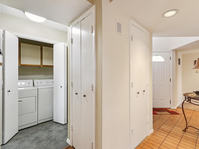 19 Park Ln, Bedford, TX 76021 - washroom with separate washer and dryer, cabinet space, light tile patterned floors, and baseboards