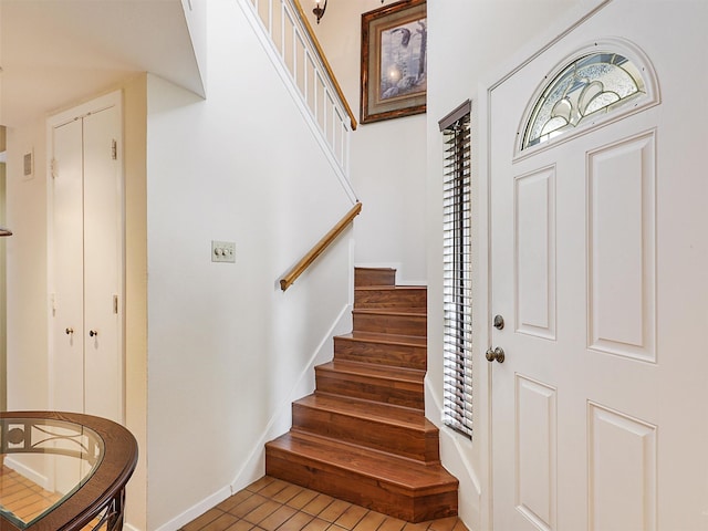19 Park Ln, Bedford, TX 76021 - foyer entrance featuring stairway and baseboards