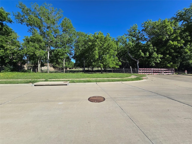 556 Pleasant Park Dr, Wilmer, TX 75172 - view of property's community with fence and view of wooded area