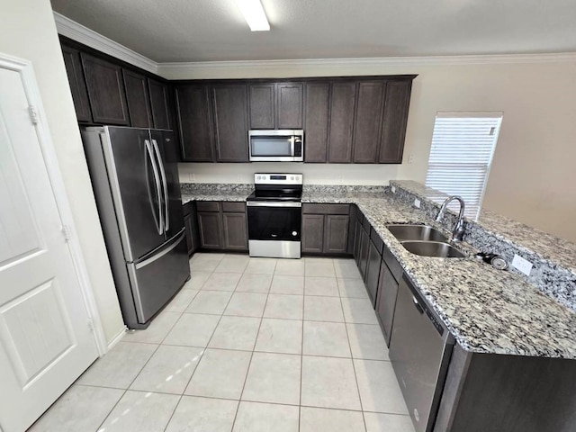 556 Pleasant Park Dr, Wilmer, TX 75172 - kitchen with appliances with stainless steel finishes, a sink, light stone countertops, a peninsula, and light tile patterned flooring