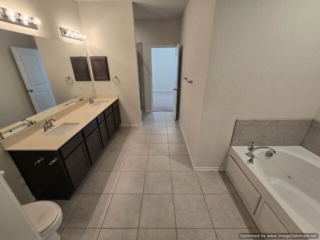 556 Pleasant Park Dr, Wilmer, TX 75172 - full bathroom featuring baseboards, toilet, tile patterned floors, a jetted tub, and double vanity