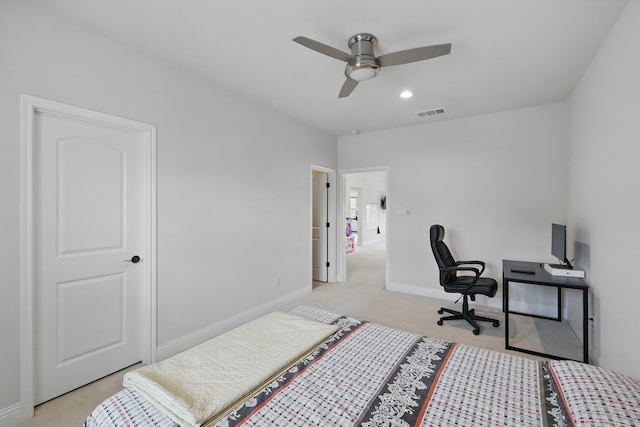 bedroom with light carpet, baseboards, an office area, and a ceiling fan