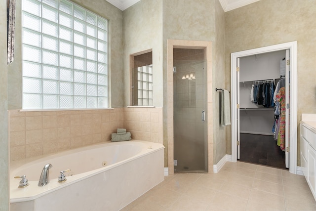 11109 Brook Green Ln, Haslet, TX 76052 - full bathroom with a stall shower, ornamental molding, a bath, a spacious closet, and tile patterned floors