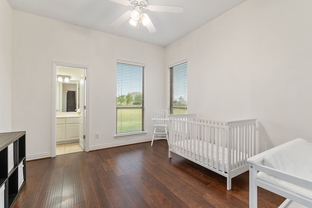 11109 Brook Green Ln, Haslet, TX 76052 - bedroom featuring wood finished floors, ceiling fan, baseboards, and a crib