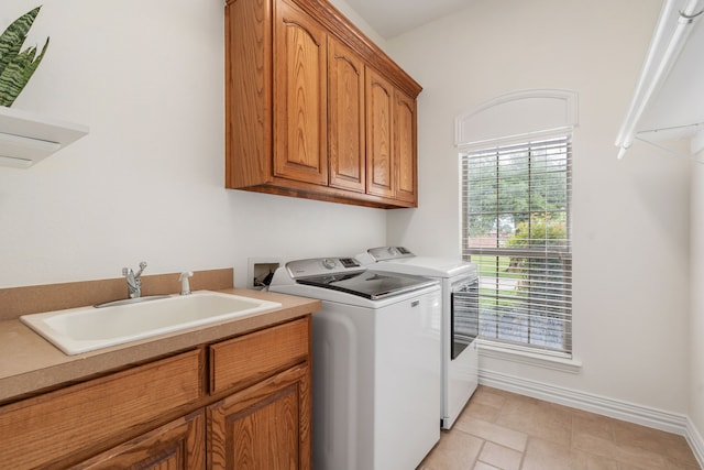 11109 Brook Green Ln, Haslet, TX 76052 - laundry room featuring cabinet space, washing machine and dryer, baseboards, and light tile patterned flooring