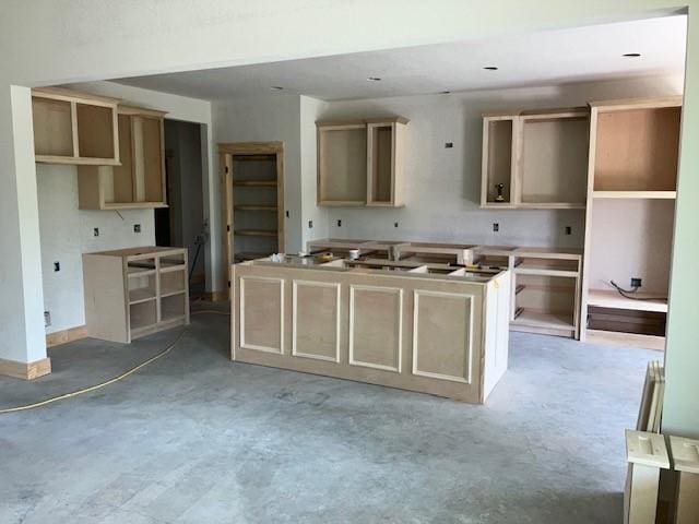 122 Vick, Brownwood, TX 76801 - kitchen with a center island and unfinished concrete floors