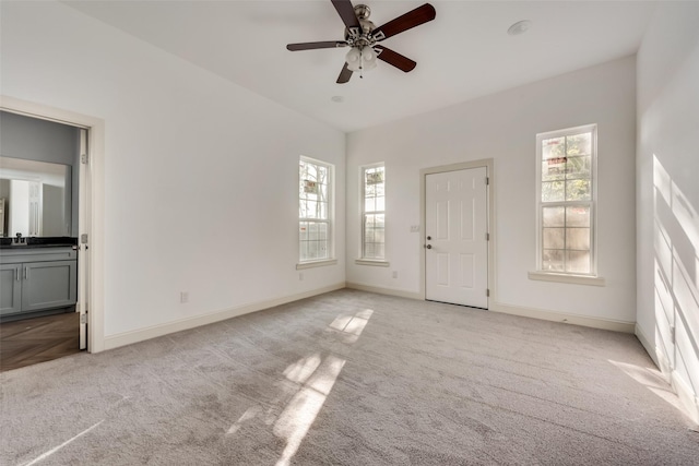 1408 Spinnaker Ln, Azle, TX 76020 - unfurnished room with light carpet, healthy amount of natural light, baseboards, and a ceiling fan