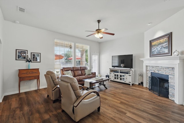 6429 Lakewood Dr, Sachse, TX 75048 - living room with a ceiling fan, wood finished floors, a stone fireplace, and baseboards
