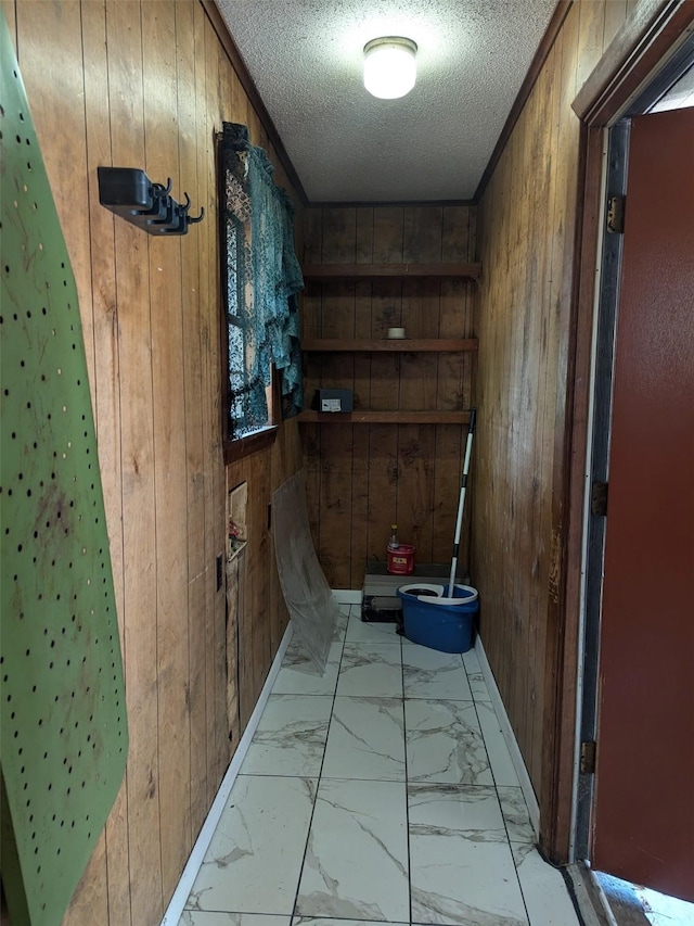 11728 Fm 1399, Marietta, TX 75566 - bathroom featuring wood walls, a textured ceiling, and marble finish floors