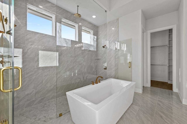 4316 Sandbrock Pkwy, Aubrey, TX 76227 - full bath featuring a stall shower, a freestanding bath, and a walk in closet