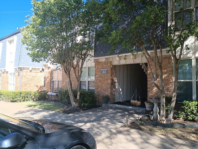 539 W Lookout Dr Unit 135, Richardson, TX 75080 - view of front of home featuring brick siding