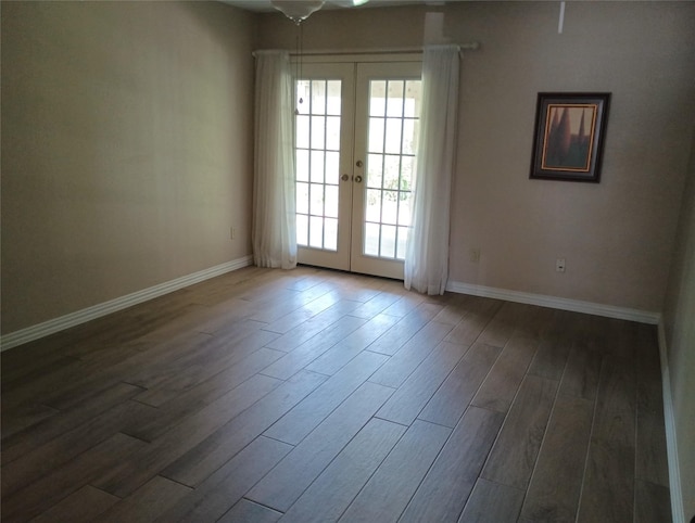 539 W Lookout Dr Unit 135, Richardson, TX 75080 - empty room with french doors, wood finished floors, and baseboards