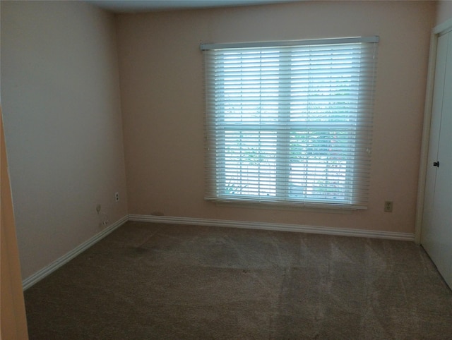 539 W Lookout Dr Unit 135, Richardson, TX 75080 - unfurnished room with carpet flooring and baseboards