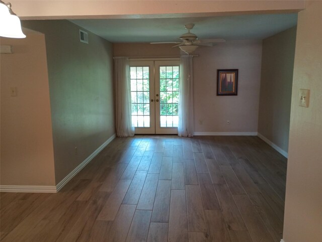 539 W Lookout Dr Unit 135, Richardson, TX 75080 - empty room featuring french doors, ceiling fan, wood finished floors, and baseboards