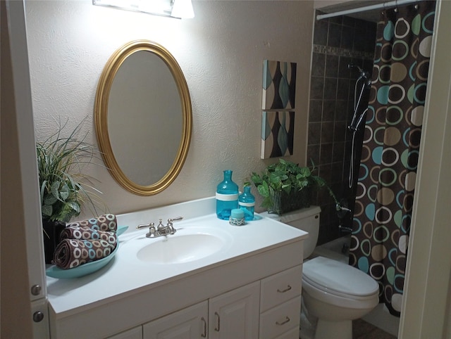 539 W Lookout Dr Unit 135, Richardson, TX 75080 - full bathroom featuring vanity, toilet, and a textured wall