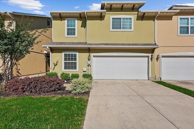 4127 Nia Dr, Irving, TX 75038 - multi unit property with stucco siding, driveway, and an attached garage
