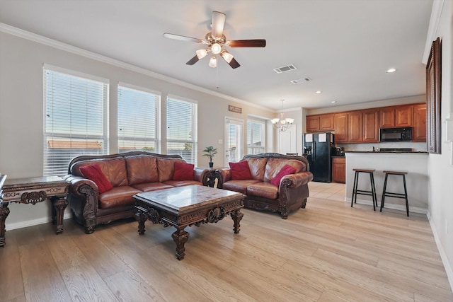 4127 Nia Dr, Irving, TX 75038 - living room with a chandelier, crown molding, a ceiling fan, light wood-style flooring, and recessed lighting