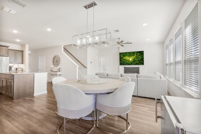 628 Hidden Cove Dr, Princeton, TX 75407 - dining space with light wood-type flooring, recessed lighting, a ceiling fan, stairway, and baseboards