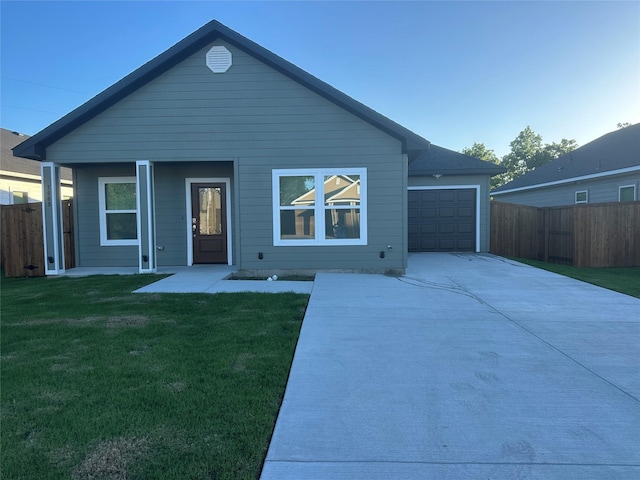 1009 S Preston St, Ennis, TX 75119 - view of front of home with driveway and a garage