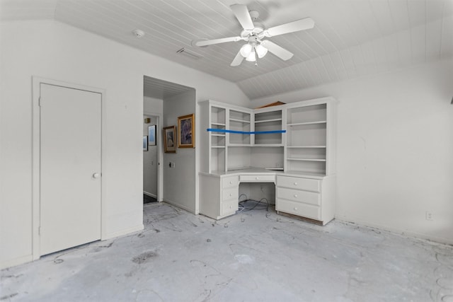 unfurnished bedroom with lofted ceiling, an office area, and a ceiling fan