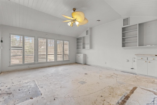 unfurnished living room featuring healthy amount of natural light, vaulted ceiling, and a ceiling fan