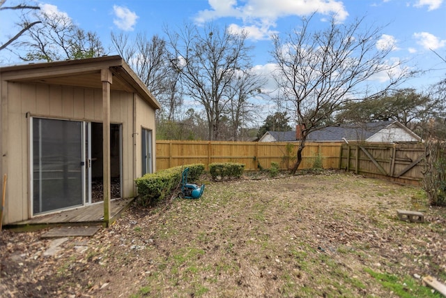 fenced backyard featuring an outdoor structure