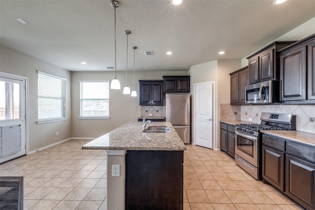 1004 Pierz Dr, Fort Worth, TX 76177 - kitchen featuring appliances with stainless steel finishes, a sink, decorative backsplash, light tile patterned floors, and recessed lighting