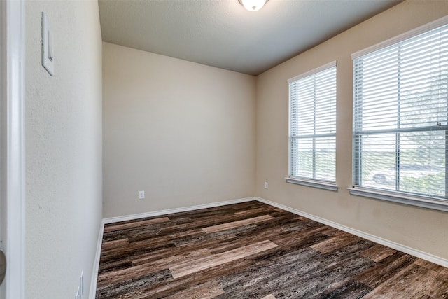 1004 Pierz Dr, Fort Worth, TX 76177 - spare room featuring dark wood-type flooring and baseboards