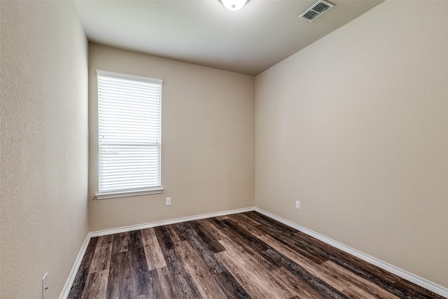 1004 Pierz Dr, Fort Worth, TX 76177 - spare room featuring dark wood-style floors, plenty of natural light, and baseboards