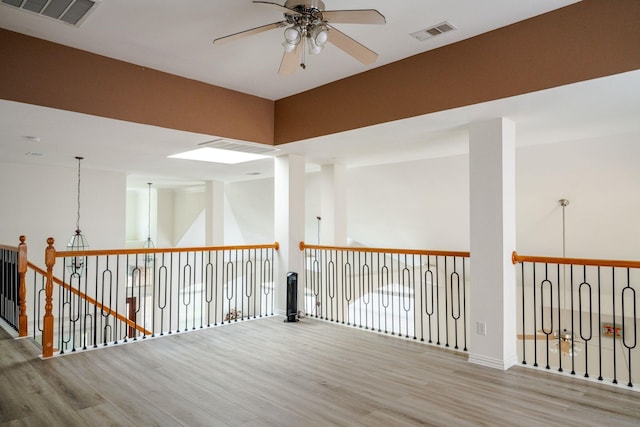 3221 Summerfield Dr, Richardson, TX 75082 - spare room with a ceiling fan, wood finished floors, and baseboards