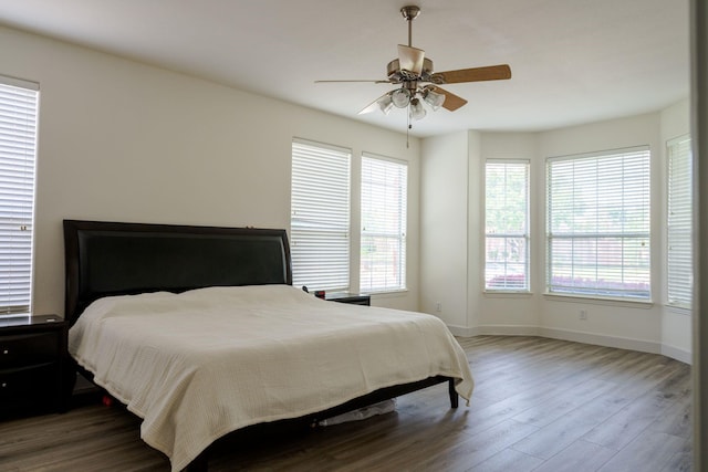 3221 Summerfield Dr, Richardson, TX 75082 - bedroom featuring wood finished floors, baseboards, and ceiling fan