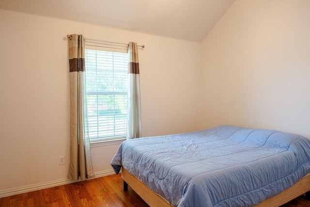3221 Summerfield Dr, Richardson, TX 75082 - bedroom featuring wood finished floors, lofted ceiling, and baseboards
