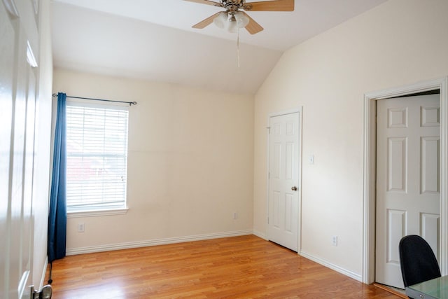 3221 Summerfield Dr, Richardson, TX 75082 - unfurnished bedroom featuring light wood-style flooring, lofted ceiling, baseboards, and a ceiling fan