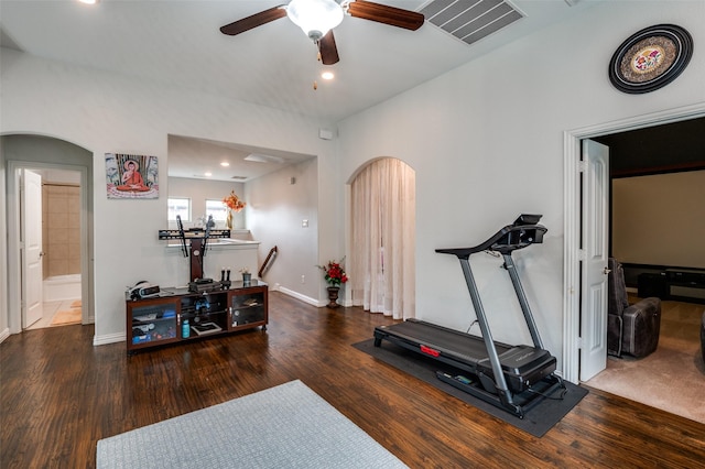 exercise room with arched walkways, ceiling fan, recessed lighting, wood finished floors, and baseboards