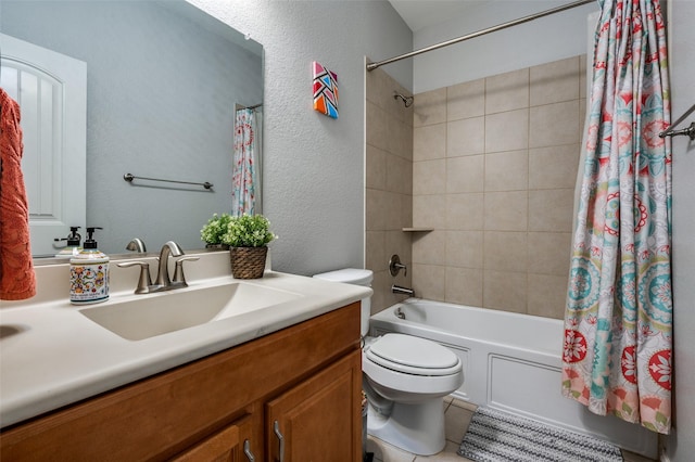 bathroom with shower / tub combo with curtain, toilet, a textured wall, vanity, and tile patterned flooring