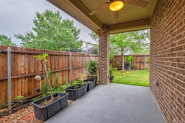 view of patio featuring ceiling fan