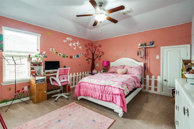 bedroom featuring multiple windows, carpet floors, and an office area