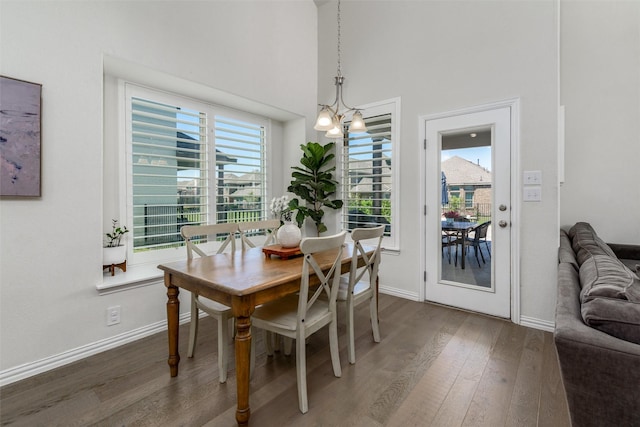 3008 Tea Olive Dr, Heath, TX 75126 - dining area with wood finished floors, baseboards, and a high ceiling