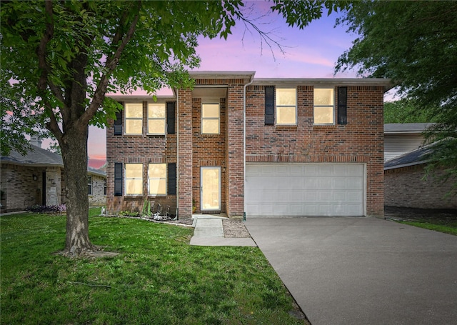 1833 Ramada Trl, Fort Worth, TX 76247 - view of front of home with driveway, an attached garage, a front lawn, and brick siding