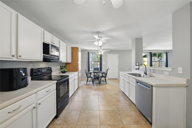 1833 Ramada Trl, Fort Worth, TX 76247 - kitchen featuring appliances with stainless steel finishes, a sink, ceiling fan, and white cabinets