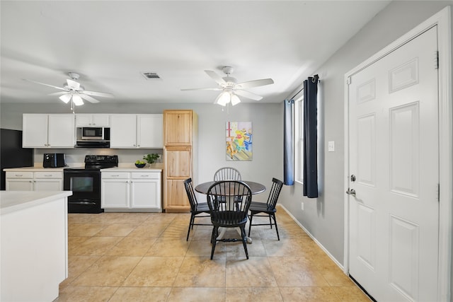 1833 Ramada Trl, Fort Worth, TX 76247 - kitchen with black appliances, a ceiling fan, white cabinets, and light countertops