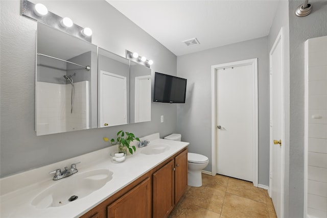 1833 Ramada Trl, Fort Worth, TX 76247 - full bathroom featuring toilet, tile patterned flooring, a shower, and double vanity